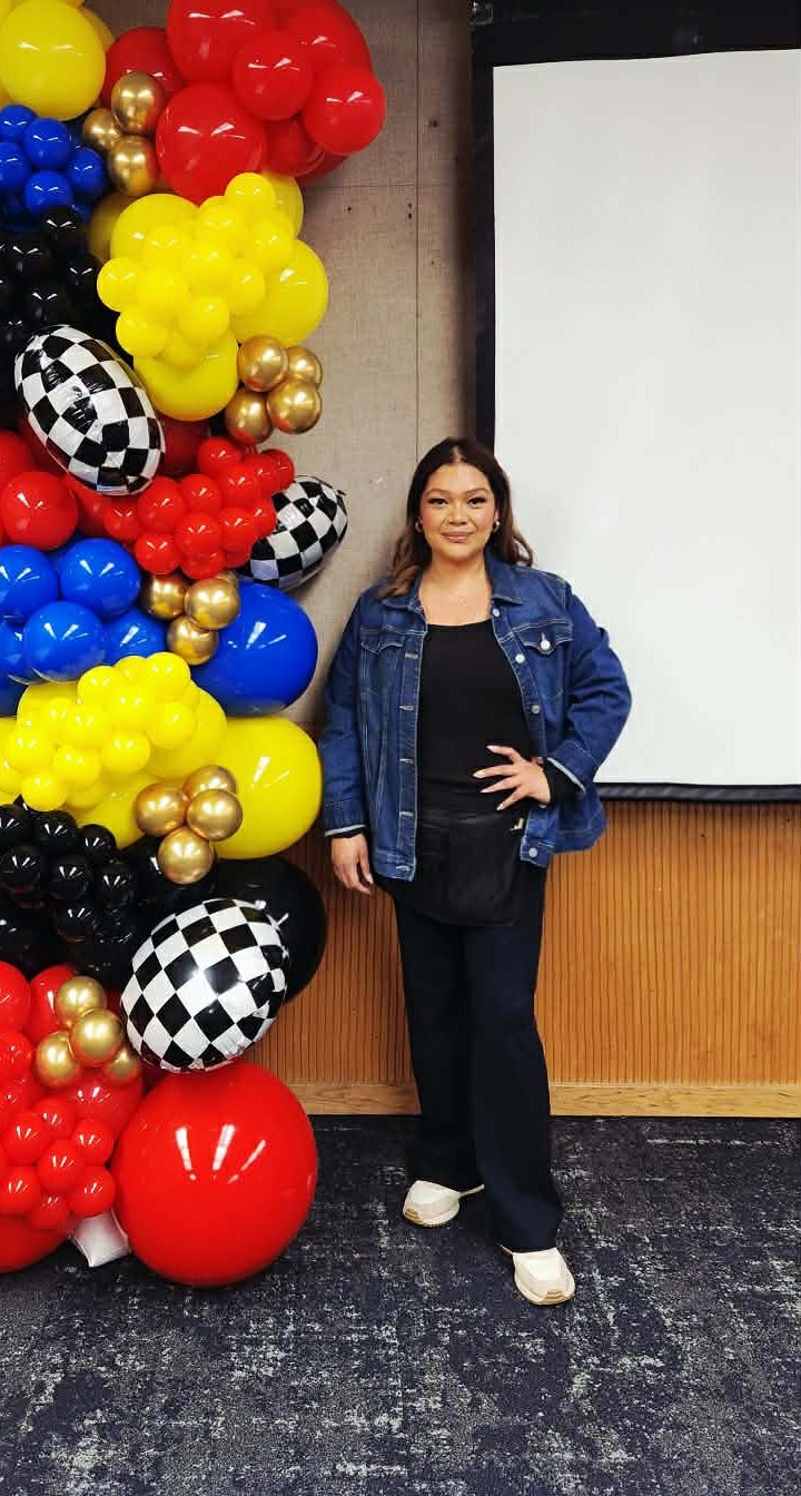 Jessy, the balloon artist behind Chicas Party Pop, beside one of her balloon installations